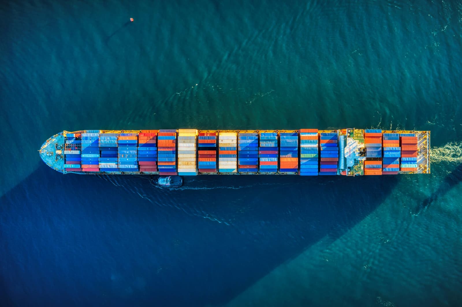 Aerial view of a loaded container ship under way at sea